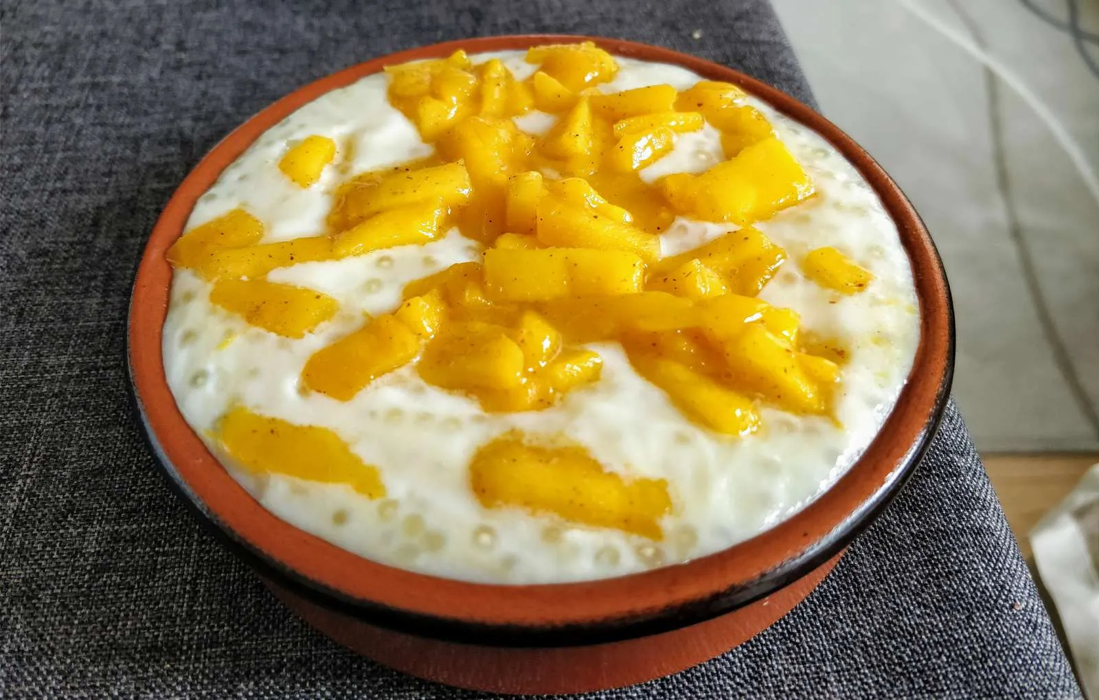 Tapioca pudding set in small ramekins, dusted with cinnamon